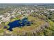 Aerial shot of a serene lake with lush vegetation at 3710 Sutton Dr, Orlando, FL 32810