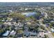 Aerial view showcasing home's location near a lake and residential neighborhood at 3710 Sutton Dr, Orlando, FL 32810