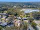 Aerial view highlighting home's lot and location near a lake at 3710 Sutton Dr, Orlando, FL 32810