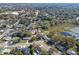 Aerial view of property, highlighting its neighborhood setting near a lake at 3710 Sutton Dr, Orlando, FL 32810