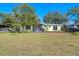 Large backyard with home and playset at 3710 Sutton Dr, Orlando, FL 32810