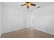 Bright bedroom with ceiling fan and closet at 3710 Sutton Dr, Orlando, FL 32810