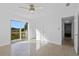 Bright bedroom with sliding glass doors to backyard at 3710 Sutton Dr, Orlando, FL 32810