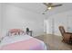 Bedroom with ceiling fan and recliner chair at 3710 Sutton Dr, Orlando, FL 32810