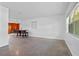 Dining area with wood-paneled accent wall and view at 3710 Sutton Dr, Orlando, FL 32810