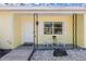 Inviting front porch with white chairs and landscaping at 3710 Sutton Dr, Orlando, FL 32810