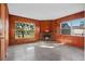 Gathering room with wood paneling, fireplace and view at 3710 Sutton Dr, Orlando, FL 32810