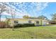 Charming yellow ranch home with lawn at 3710 Sutton Dr, Orlando, FL 32810