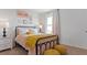 Cozy bedroom with a bed, nightstands, and yellow accents at 3852 Rory Pond Ct, Lakeland, FL 33811