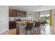 Kitchen with island, dark brown cabinets, and stainless steel appliances at 3852 Rory Pond Ct, Lakeland, FL 33811