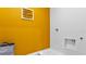 Laundry room with bright yellow walls and built-in cabinets at 3852 Rory Pond Ct, Lakeland, FL 33811