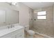 Bathroom with walk-in shower and updated vanity at 3886 Lake Mirage Blvd, Orlando, FL 32817