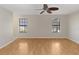 Large bedroom with hardwood floors and ceiling fan at 3886 Lake Mirage Blvd, Orlando, FL 32817