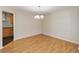 Bright dining room with hardwood floors and a chandelier at 3886 Lake Mirage Blvd, Orlando, FL 32817