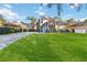 Two-story house with a paved driveway and manicured lawn at 3886 Lake Mirage Blvd, Orlando, FL 32817