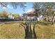 Two-story house with a paved driveway and manicured lawn at 3886 Lake Mirage Blvd, Orlando, FL 32817