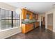 Kitchen with wood cabinets, granite counters, and stainless steel appliances at 3886 Lake Mirage Blvd, Orlando, FL 32817