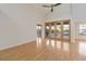 Living room with hardwood floors and access to the pool at 3886 Lake Mirage Blvd, Orlando, FL 32817