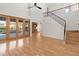 Living room with hardwood floors, fireplace, and access to the pool at 3886 Lake Mirage Blvd, Orlando, FL 32817