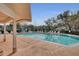 Inviting community pool with plenty of lounge chairs for relaxing at 3886 Lake Mirage Blvd, Orlando, FL 32817