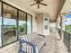 Spacious balcony with seating and golf course views at 395 Muirfield Loop, Reunion, FL 34747