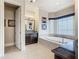 Luxury bathroom with a free-standing tub and dark wood vanity at 395 Muirfield Loop, Reunion, FL 34747