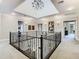 Open and bright second floor hallway with chandelier at 395 Muirfield Loop, Reunion, FL 34747