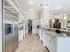 Modern kitchen with stainless steel appliances and granite countertops at 395 Muirfield Loop, Reunion, FL 34747