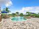 Relaxing freeform pool and spa with patio area at 395 Muirfield Loop, Reunion, FL 34747