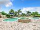 Inviting freeform pool and spa with lounge chairs at 395 Muirfield Loop, Reunion, FL 34747