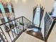 Impressive staircase with ornate railing overlooking game room at 395 Muirfield Loop, Reunion, FL 34747