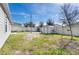 Backyard with shed, grassy area and swing set at 445 N Andrea Cir, Haines City, FL 33844