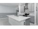 Modern kitchen with gray cabinets and white countertops at 445 N Andrea Cir, Haines City, FL 33844