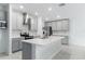 Modern kitchen with gray cabinets, white countertops, and island at 445 N Andrea Cir, Haines City, FL 33844