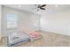 Large bedroom with carpeted floors and a ceiling fan at 4457 Lions Gate Ave, Clermont, FL 34711