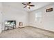 Spacious bedroom with carpeted floor, TV, and window coverings at 4457 Lions Gate Ave, Clermont, FL 34711