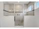 Walk-in shower with glass enclosure and tile surround at 4457 Lions Gate Ave, Clermont, FL 34711