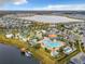 Aerial view of community with pool, lake, and other amenities at 4731 Clock Tower Dr # 203, Kissimmee, FL 34746