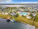 Aerial view of community amenities including pool, lake, and clubhouse at 4731 Clock Tower Dr # 203, Kissimmee, FL 34746