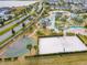 Aerial view of community amenities including pools, courts and clubhouse at 4731 Clock Tower Dr # 203, Kissimmee, FL 34746