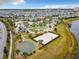 Aerial view of community amenities including pools, courts and clubhouse at 4731 Clock Tower Dr # 203, Kissimmee, FL 34746