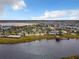 Aerial view of community, highlighting the resort-style pool and lake access at 4731 Clock Tower Dr # 203, Kissimmee, FL 34746