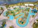 Aerial view of resort-style pool with lazy river, water slide, and mini golf at 4731 Clock Tower Dr # 203, Kissimmee, FL 34746