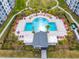 Resort-style pool with lounge chairs and a poolside cabana at 4731 Clock Tower Dr # 203, Kissimmee, FL 34746