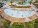 Interactive splash pad with various spray features for children at 4731 Clock Tower Dr # 203, Kissimmee, FL 34746