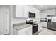 Modern kitchen with stainless steel appliances and granite countertops at 4823 Cranberry Way, Lakeland, FL 33811