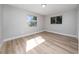 Spacious bedroom featuring light walls and wood-look floors at 501 S Lacy Cir, Deltona, FL 32725