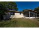 Home exterior showcasing a screened patio at 501 S Lacy Cir, Deltona, FL 32725