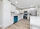 Newly remodeled kitchen, featuring white shaker cabinets and teal dishwasher at 501 S Lacy Cir, Deltona, FL 32725