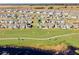 Aerial view of a house in a community by a lake at 5157 Citrus Leaf Blvd, Winter Garden, FL 34787